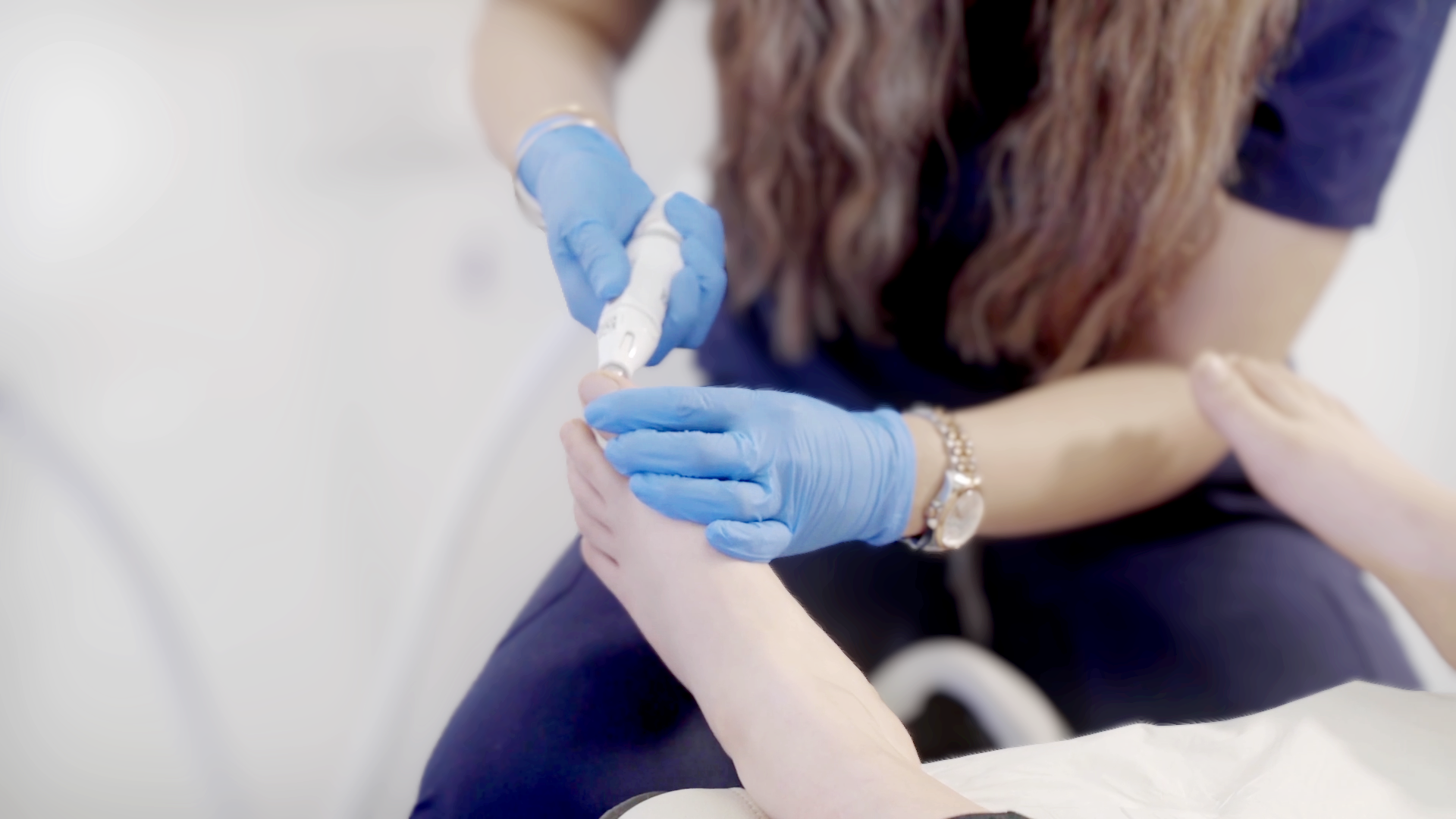 A patient's foot being treated by a podiatrist using Swift